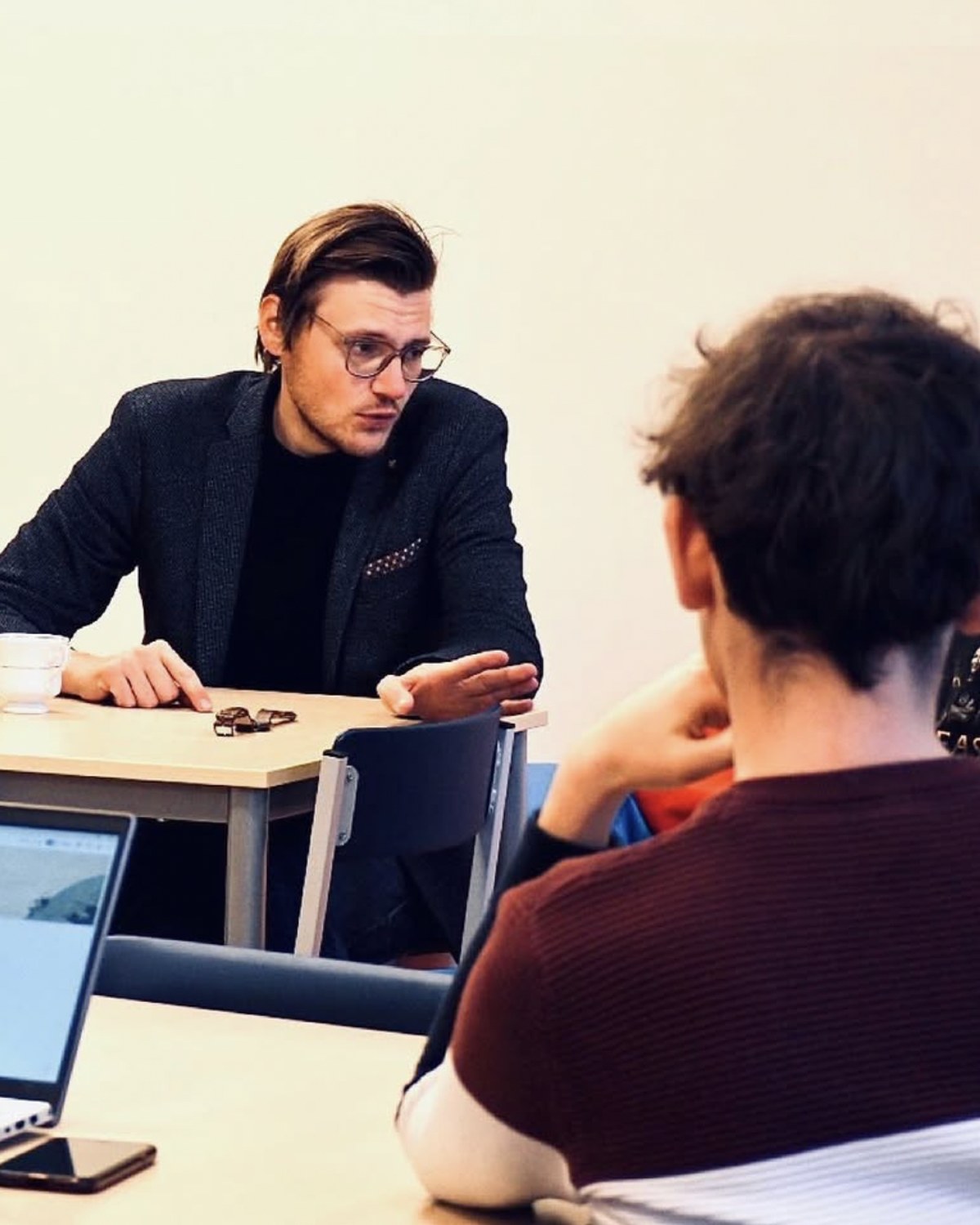 Mr. Miha Andrič in a small-group seminar discussion