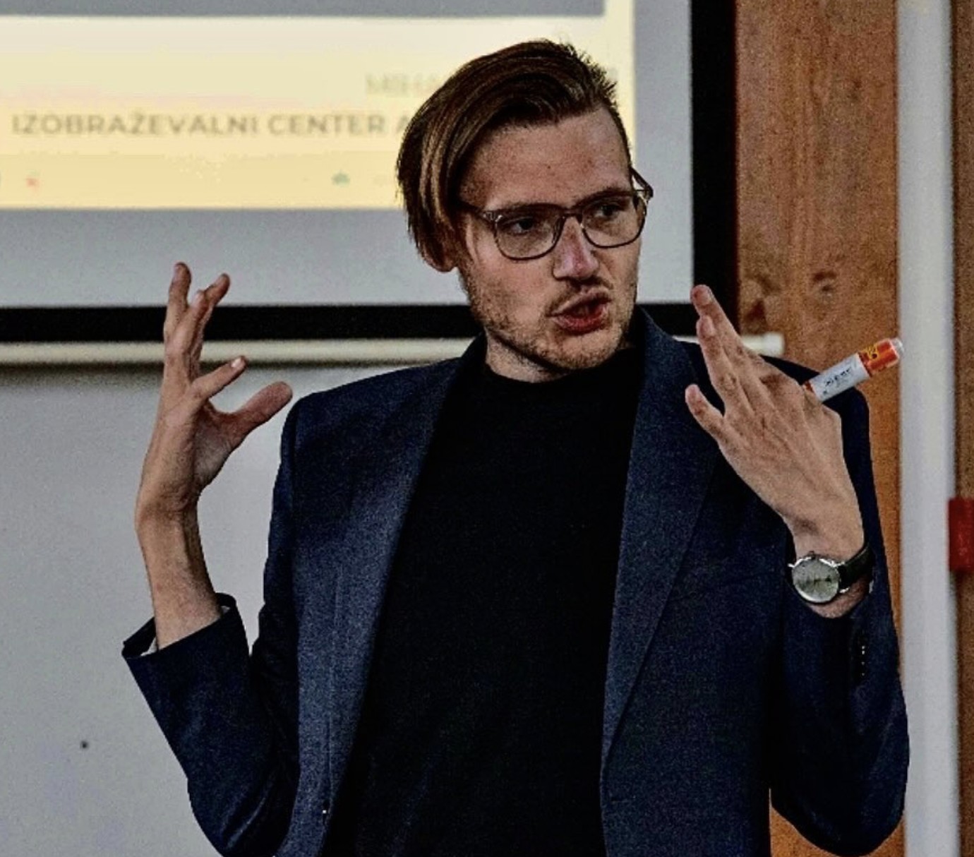 Mr. Miha Andrič gesturing while teaching a seminar
