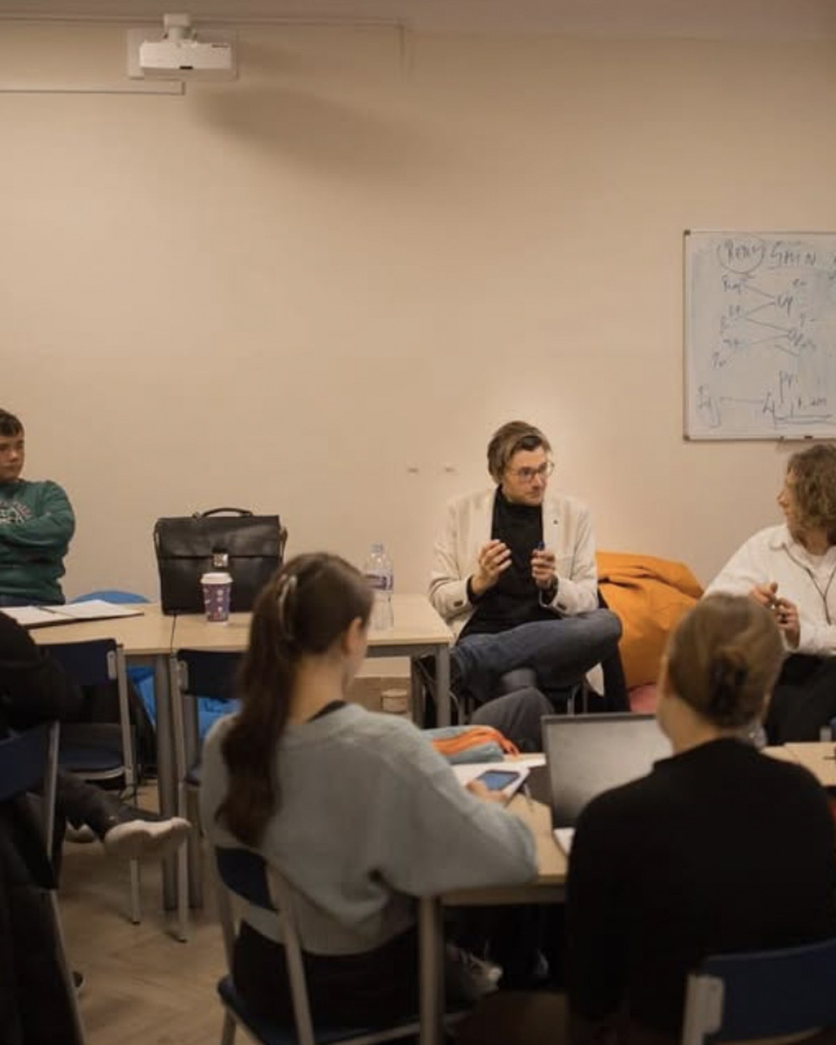 Mr. Miha Andrič moderating a classroom debate session